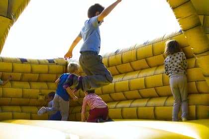 Children Playing on Inflatable Castle