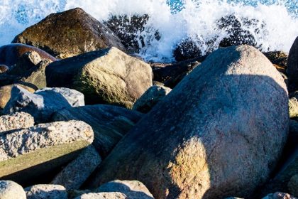 gray and brown rocks near body of water during daytime